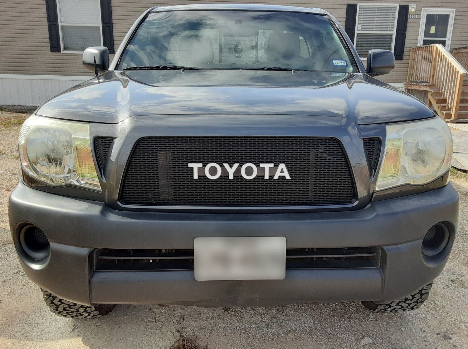 Tacoma Grille Customization: Flat Black Perforated Mesh with White Emblem